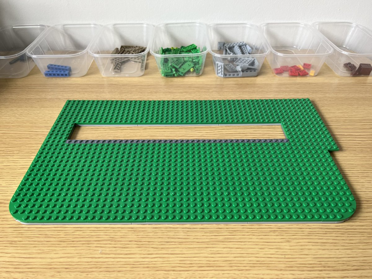 A big rectangle of green lego that’s 50 by 30 studs. There’s a cutout in the middle of the rectangle.