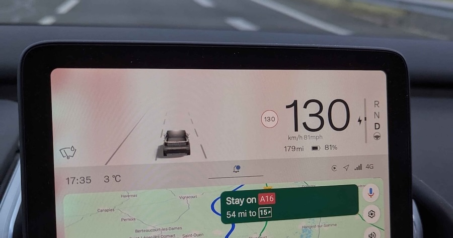 The infotainment screen in a car, showing the car travelling at 130 km/h and active google maps navigation.